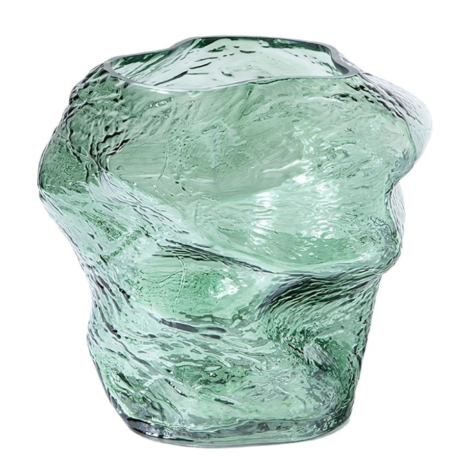 An asymmetrical shape green glass vase.