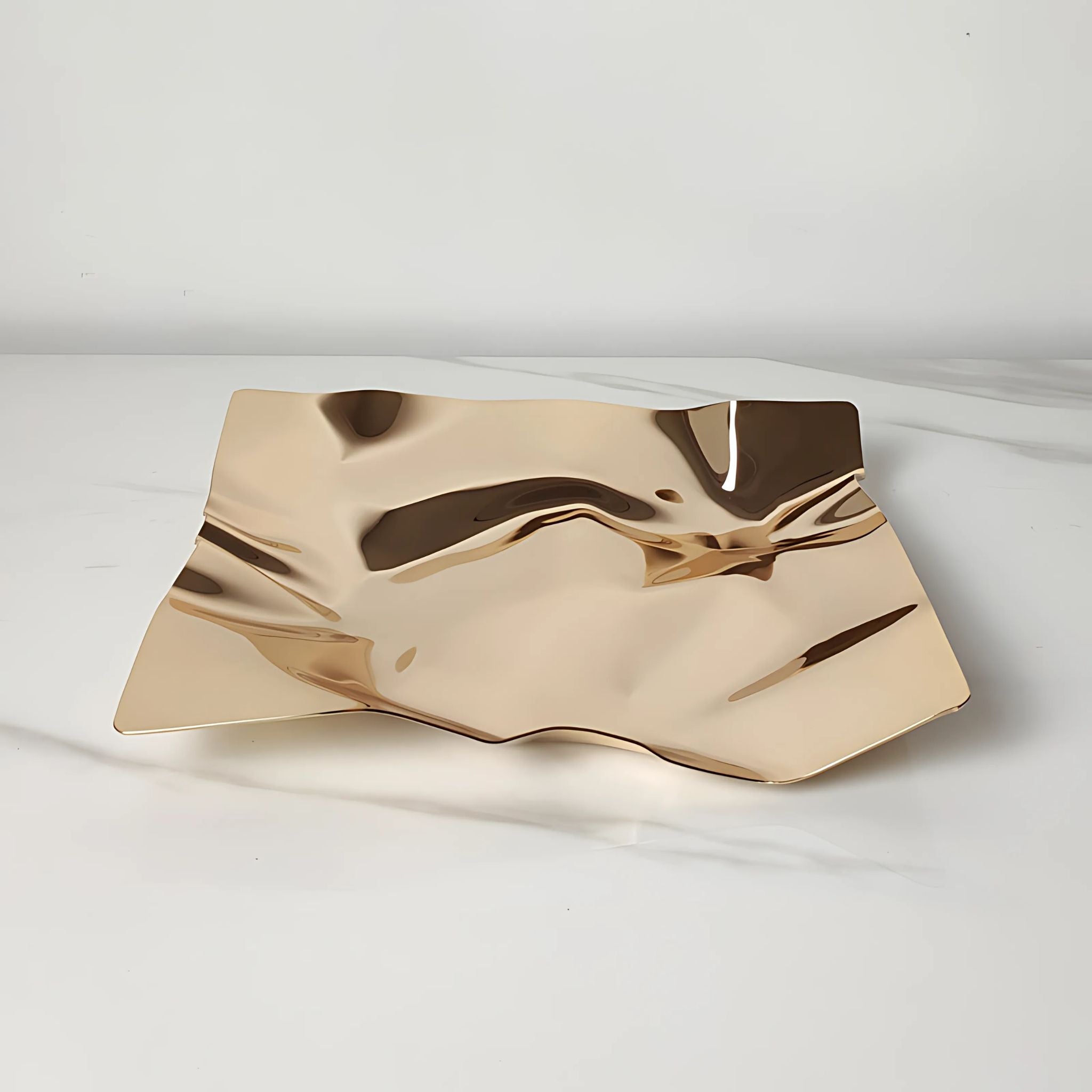 Golden metallic square decorative table tray with foil paper design.