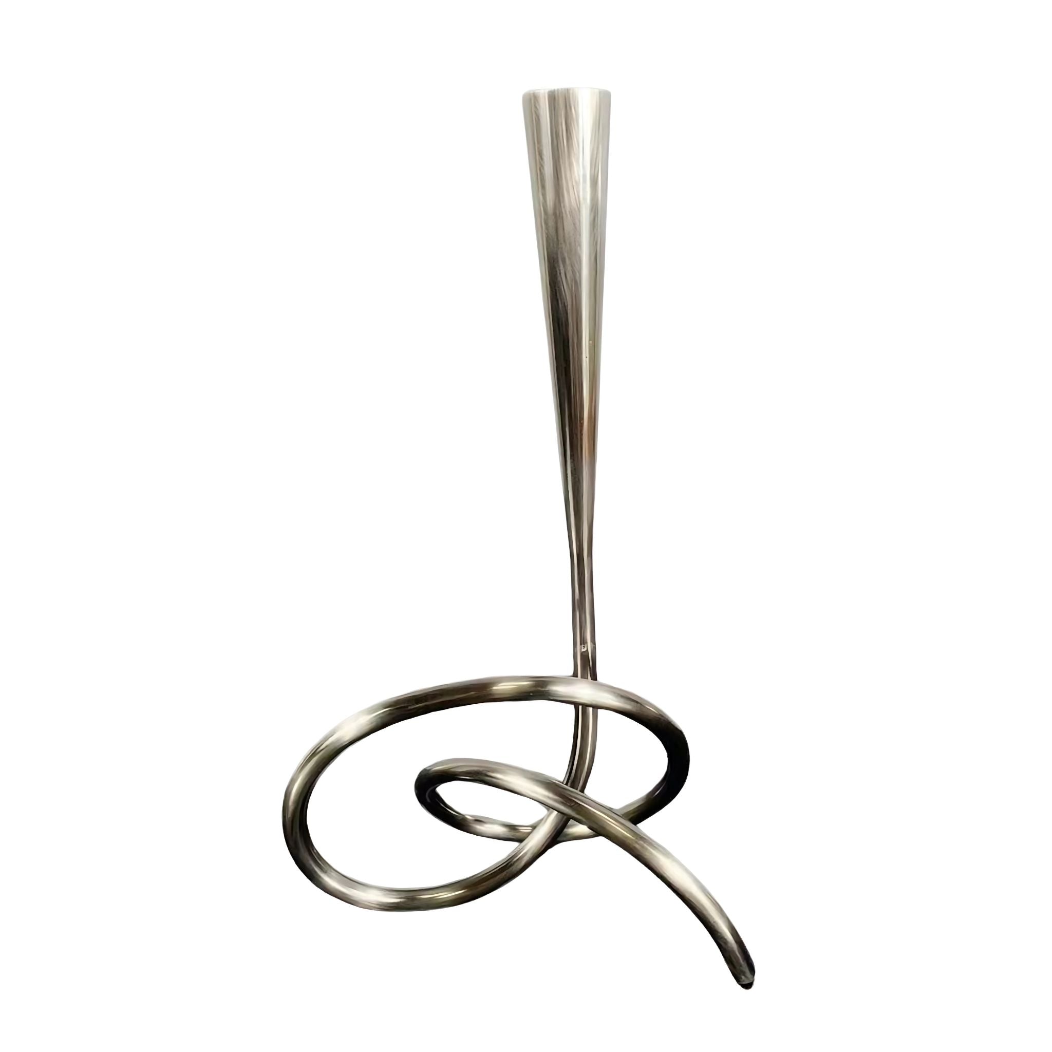 Decorative silver metallic sculptural candlestick holder.