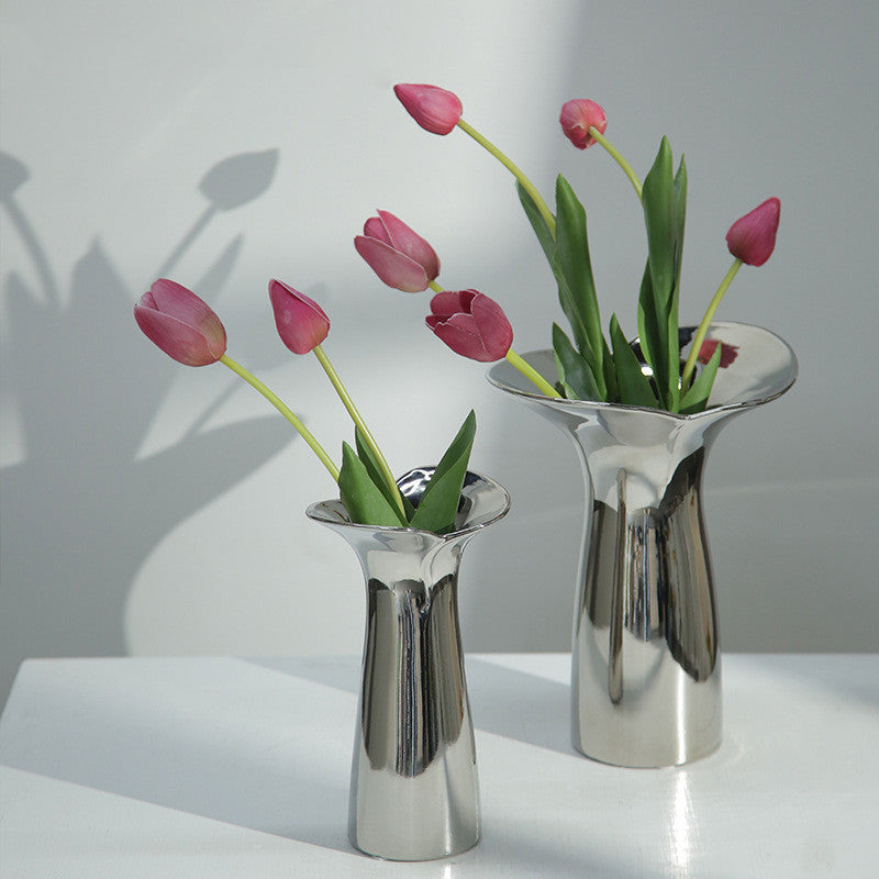 Ceramic silver electroplated Tula vases with pink tulips.