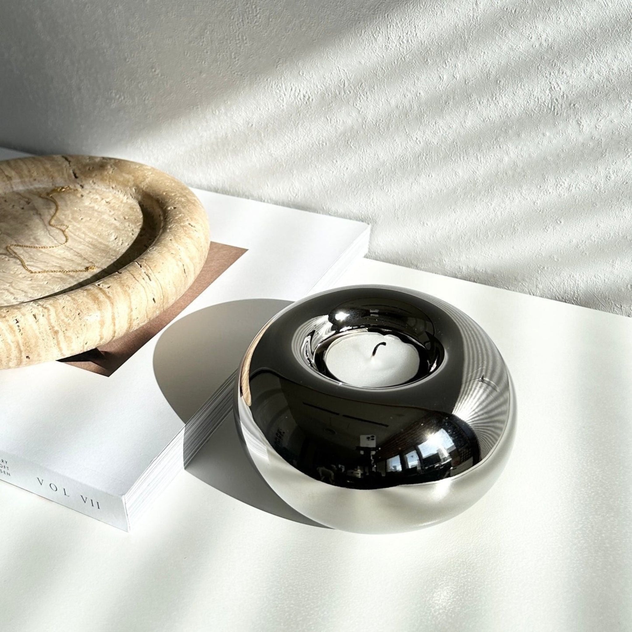 Spherical, round, chrome silver candleholder