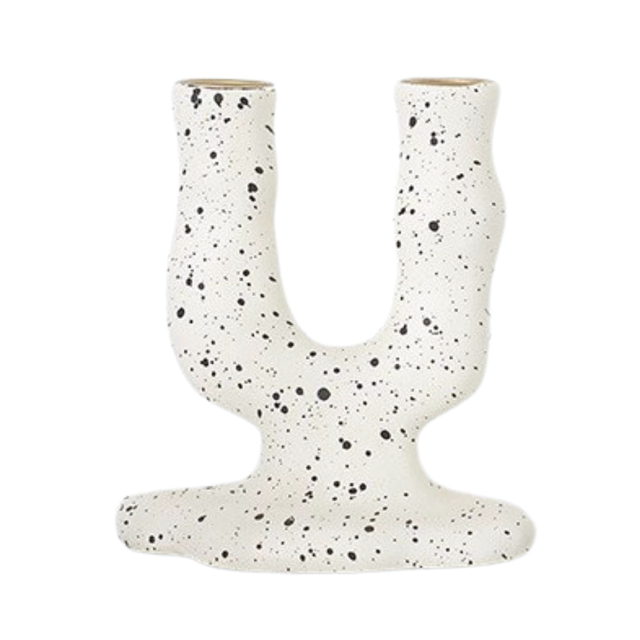 A white candlestick holder with black splash ink in arch shape for two candles.