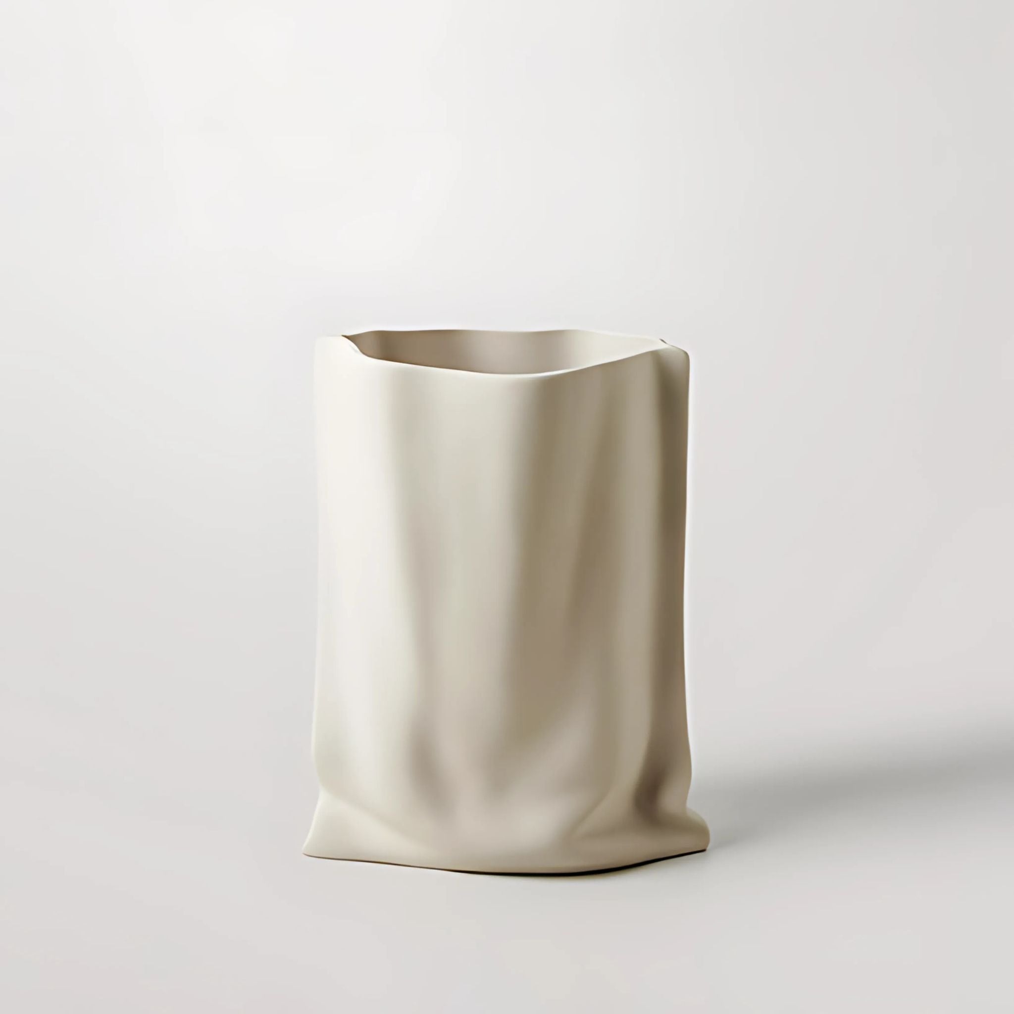 White, ceramic paper bag design decorative vase.