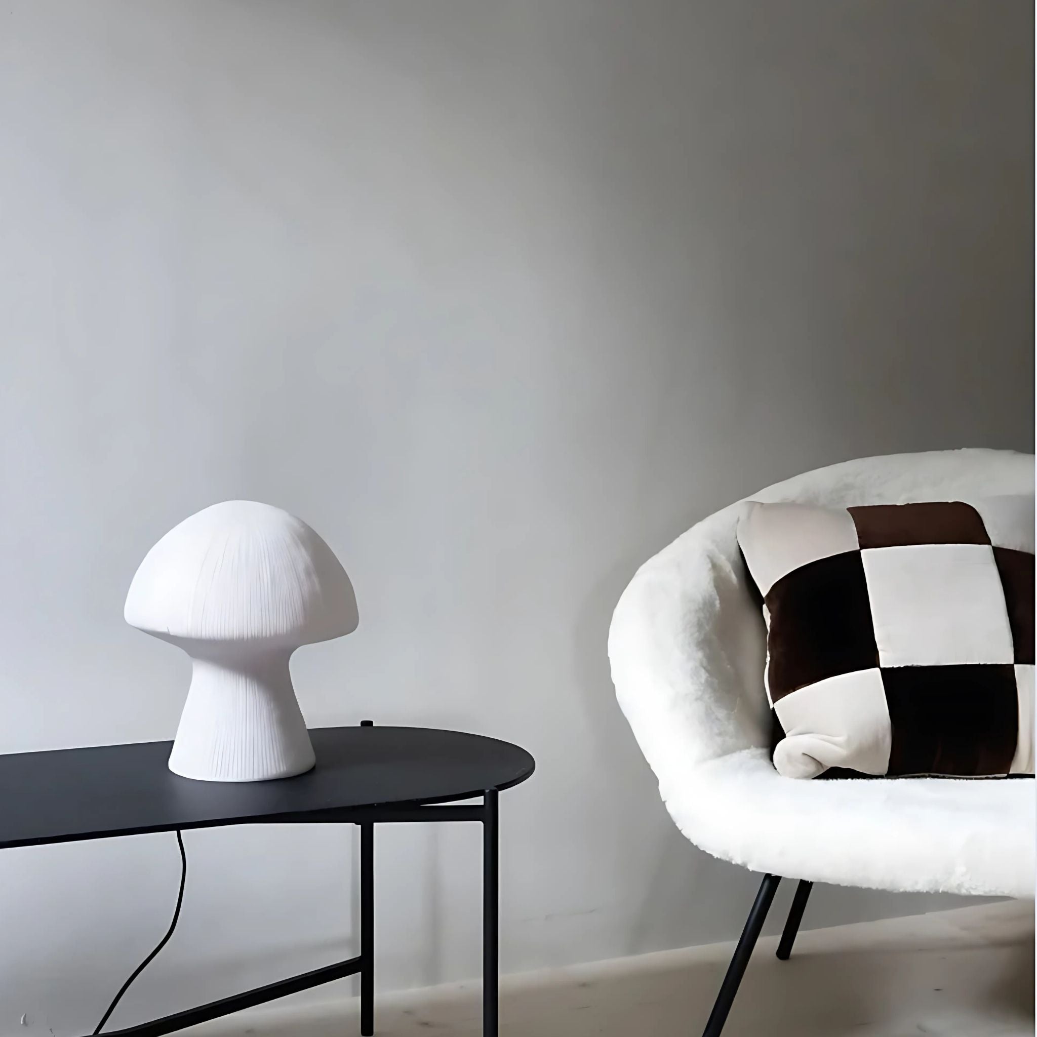 Modern, white table lamp on tabletop in Scandinavian living room.