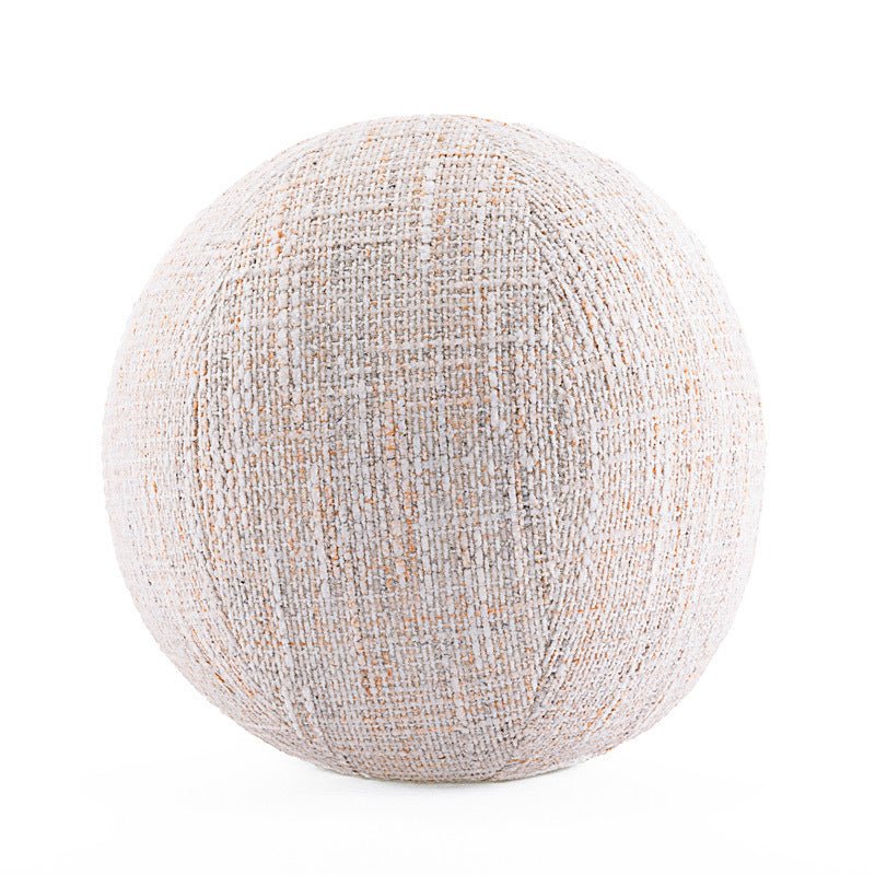Round, white, textile decor cushion.
