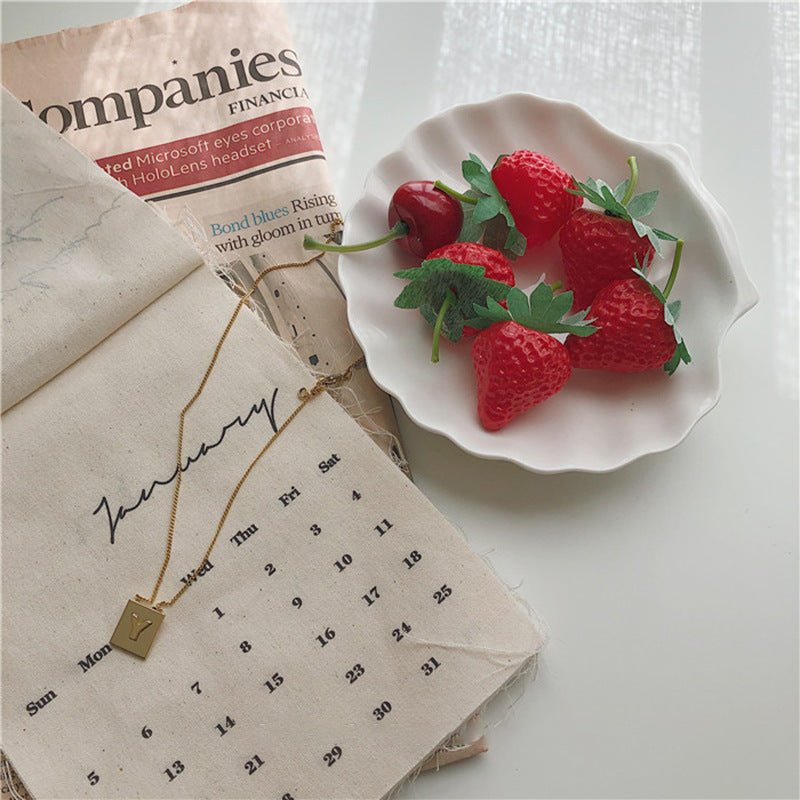 White ceramic shell tray with strawberries.
