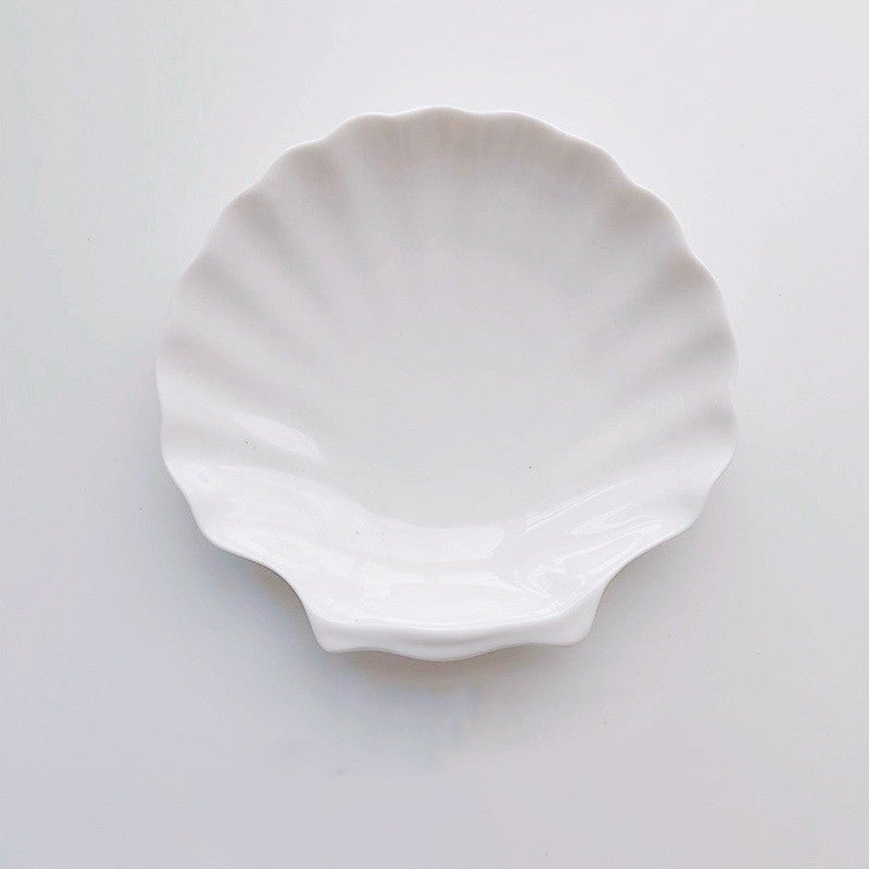 White large ceramic shell tray.