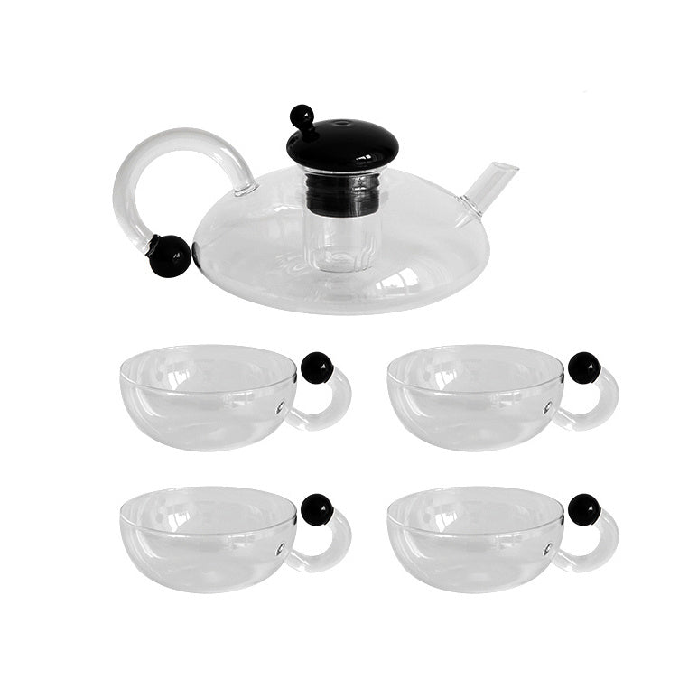 Modern glass teapot set with 4 matching glasses.
