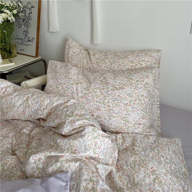 Small floral beige and purple bedding set.
