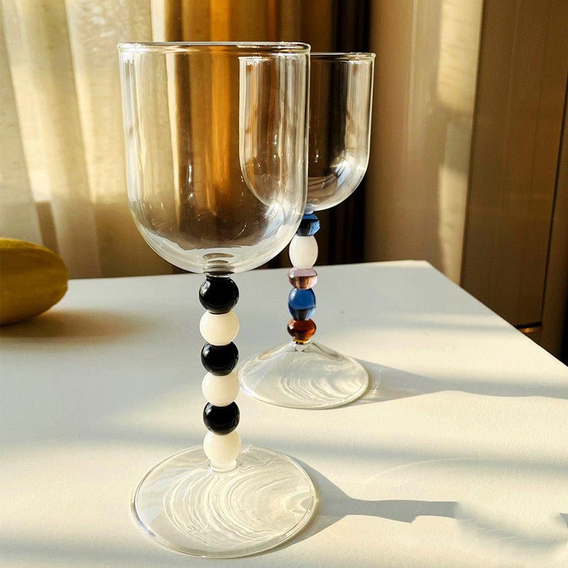 Colourful glass stemware wine glasses.