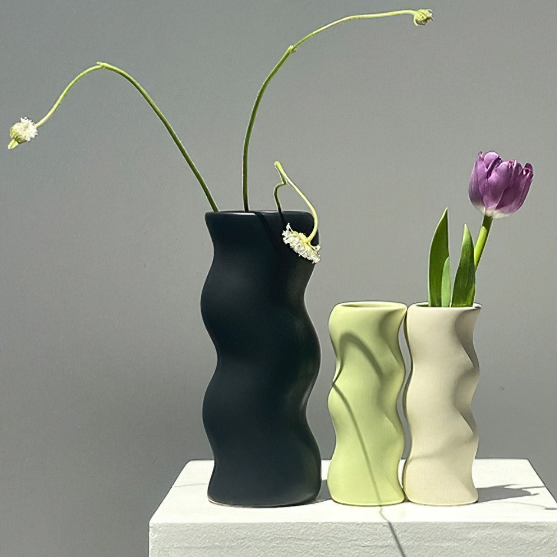 Black, green and beige ceramic wiggle flower vases