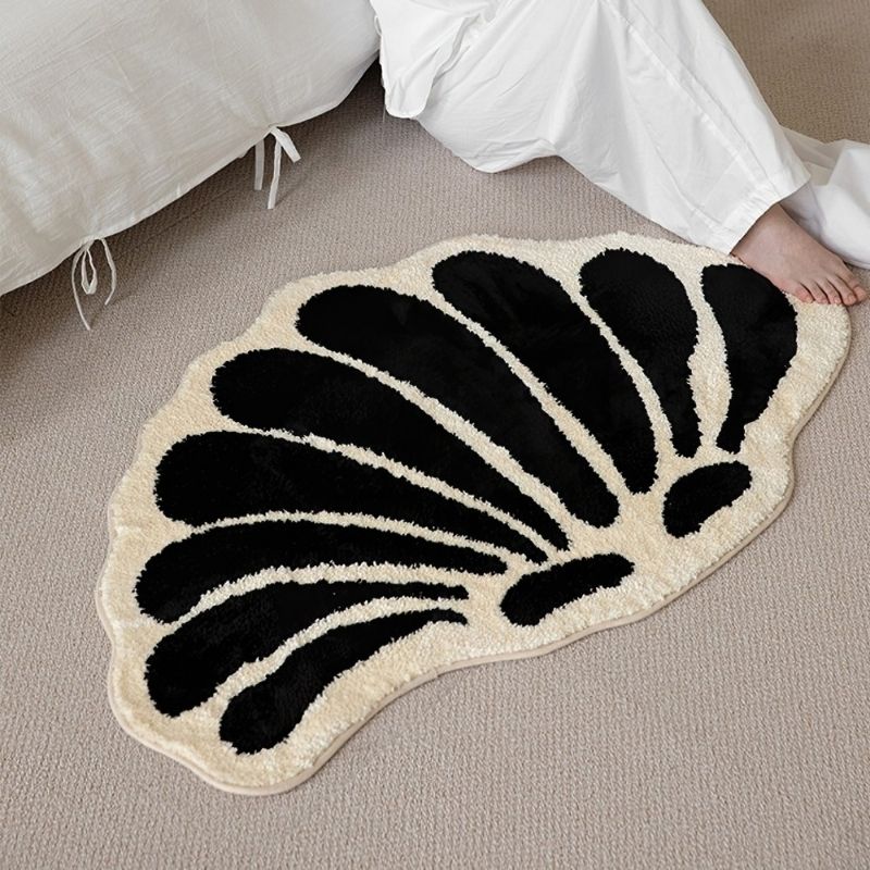 Elegant black and white shell floor rug.