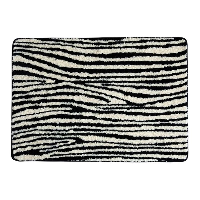 Black and white zebra animal print line floor carpet.