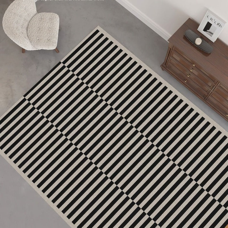 Black and white striped large area living room rug.