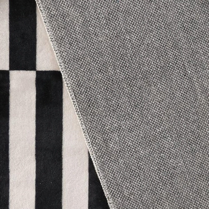 Black and white striped floor carpet backside.