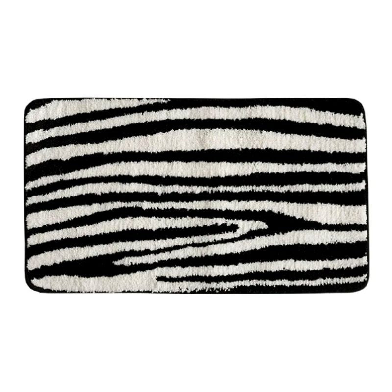 Black and white zebra animal print floor rug.