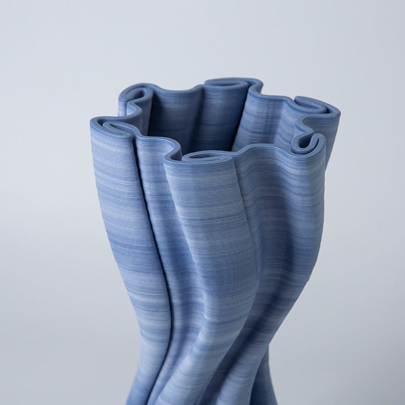 A blue, ceramic, twist design 3D vase.