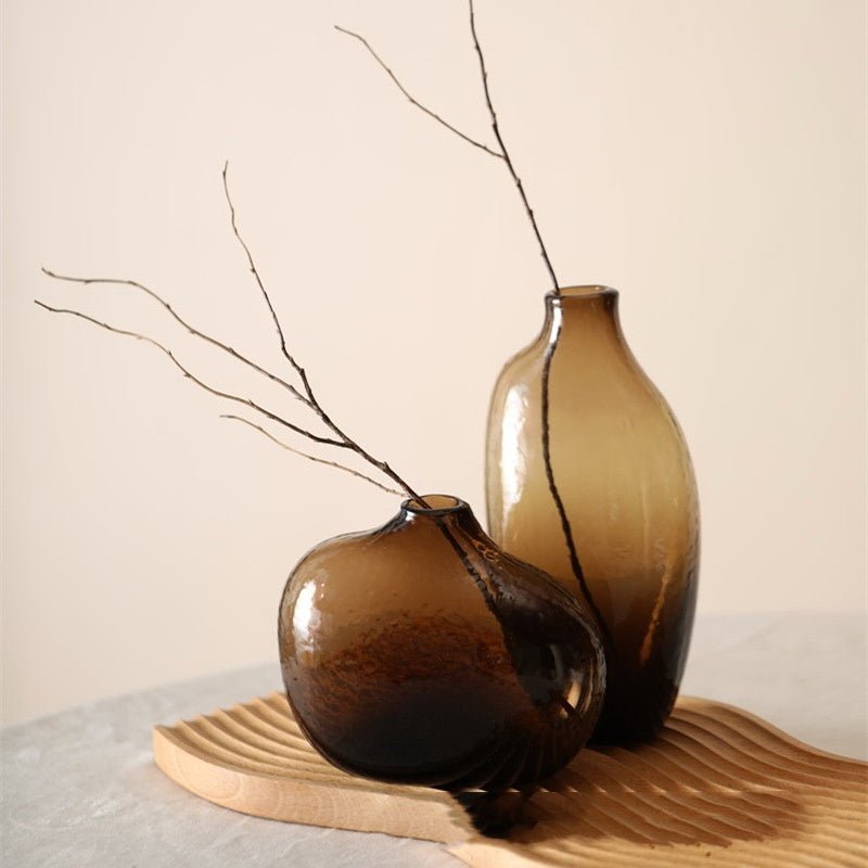 Modern, brown glass decorative vases.