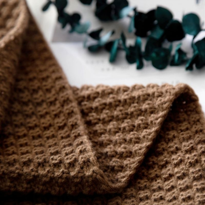 Brown knit throw blanket.
