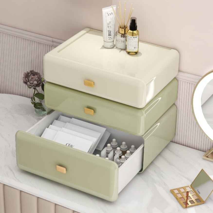 Cute decorative plastic stackable cosmetic storage boxes on table.
