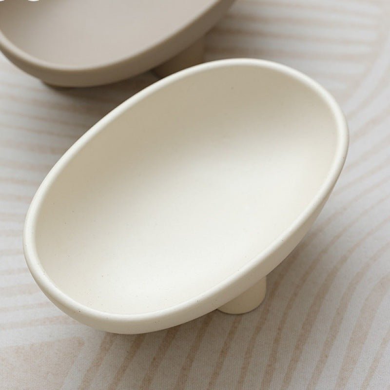 White, minimalist ceramic fruit bowl.