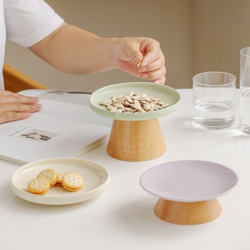 Elevated ceramic plates on dining table.