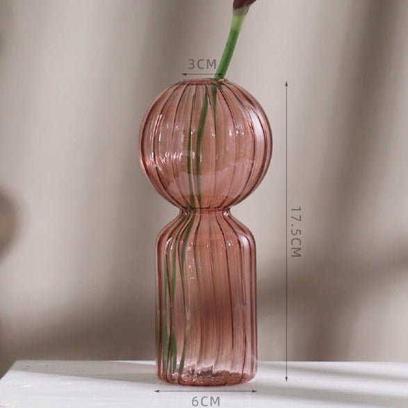 Pink glass flower vase with size info.