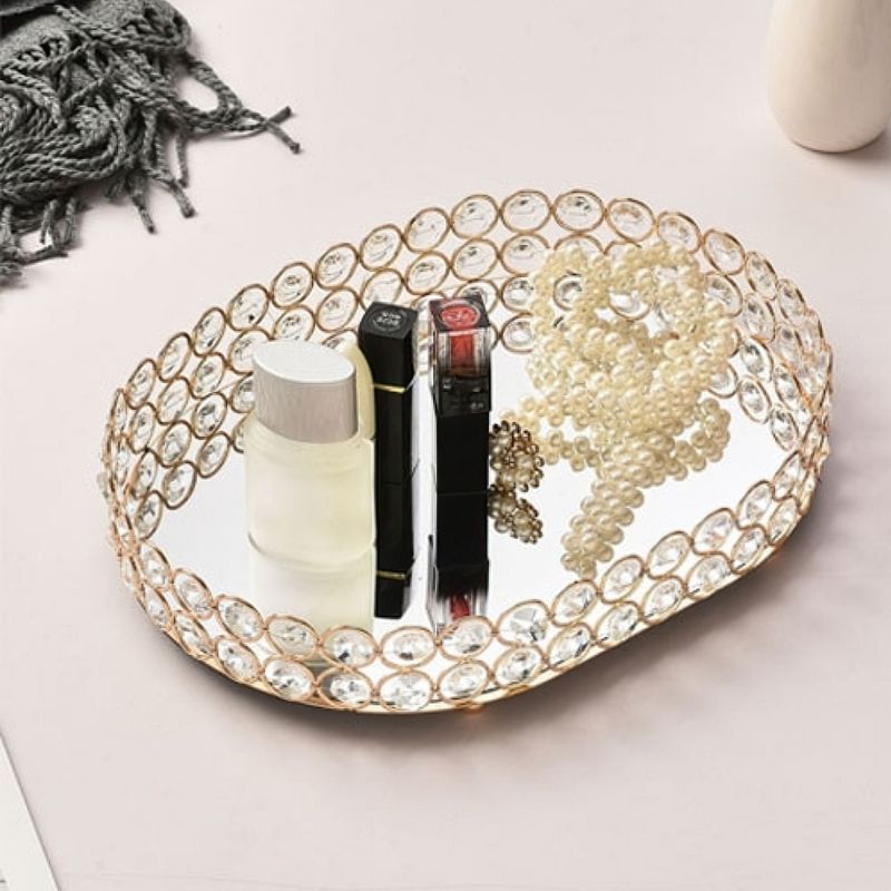 Golden oval shaped diamond jewellery decorative pearl tray.