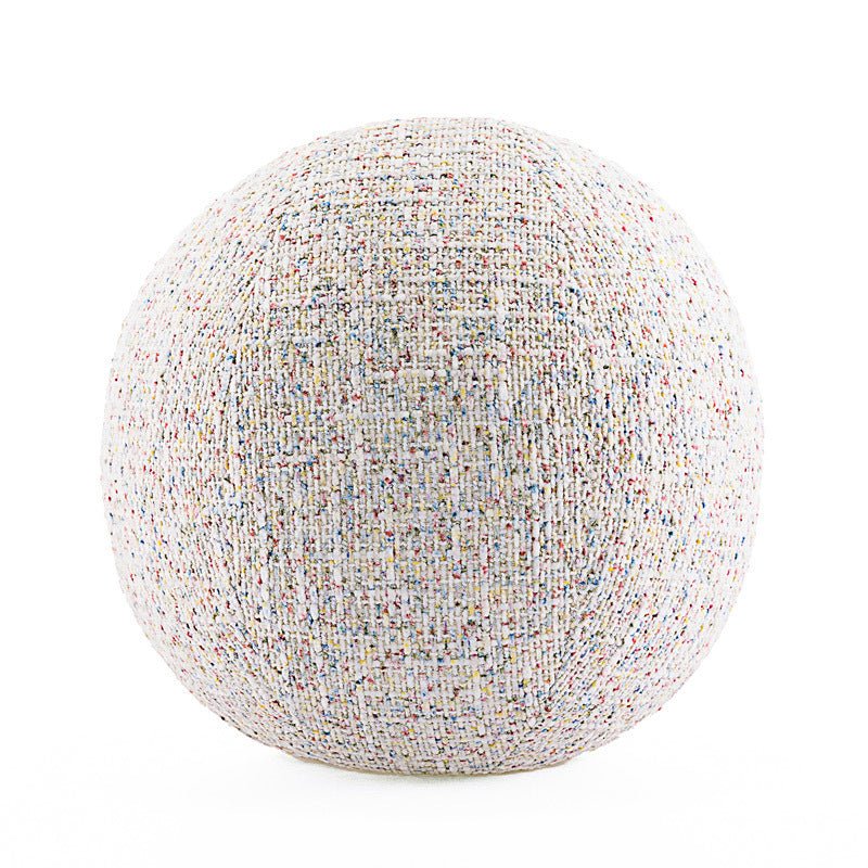 Round, ball decorative cushion with gradient, white textiles.