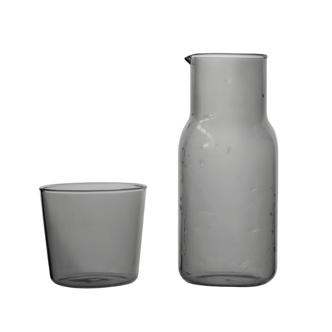 Grey glass water can with matching drinking cup lid