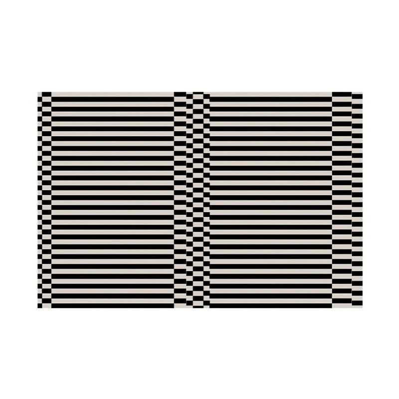 Large square black and white striped floor rug.