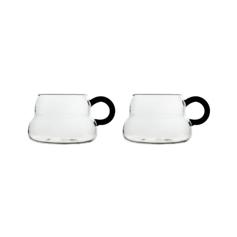 Modern glass tea cups with black handle.