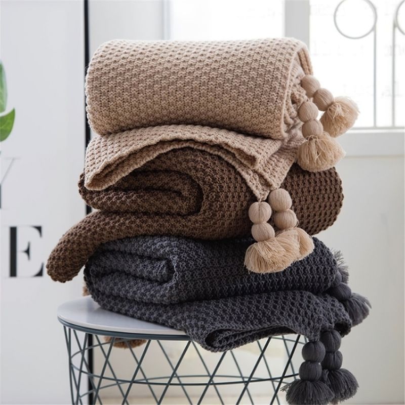 Modern nude colour knitted tassel blankets.