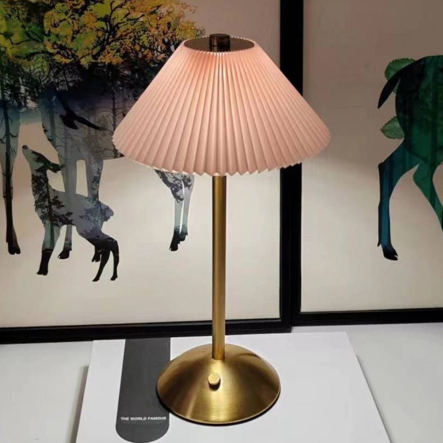Pink shade gold metal portable umbrella lamp.