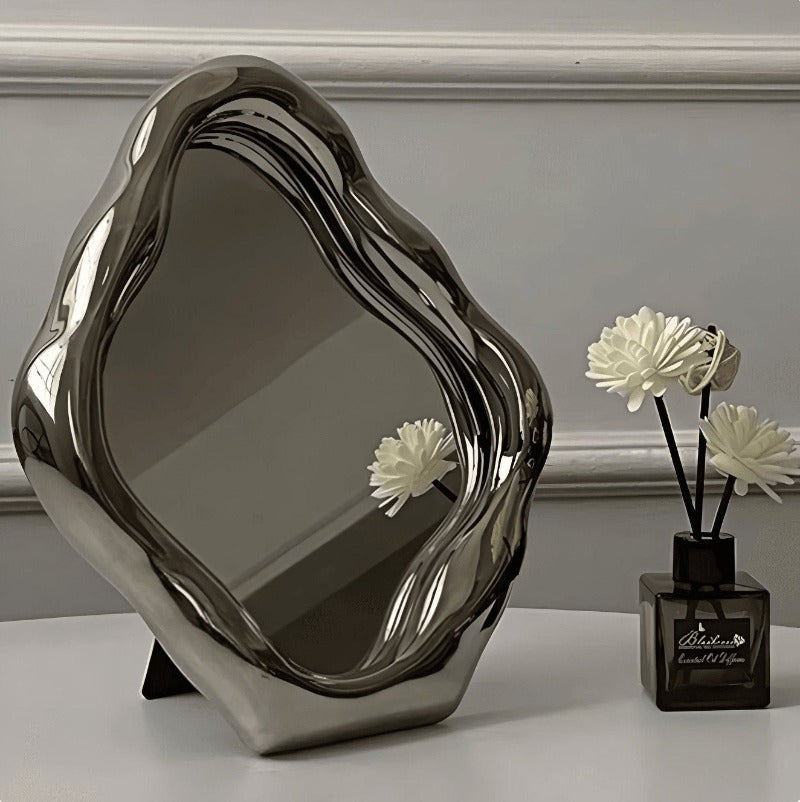 silver asymmetrical modern decor mirror.