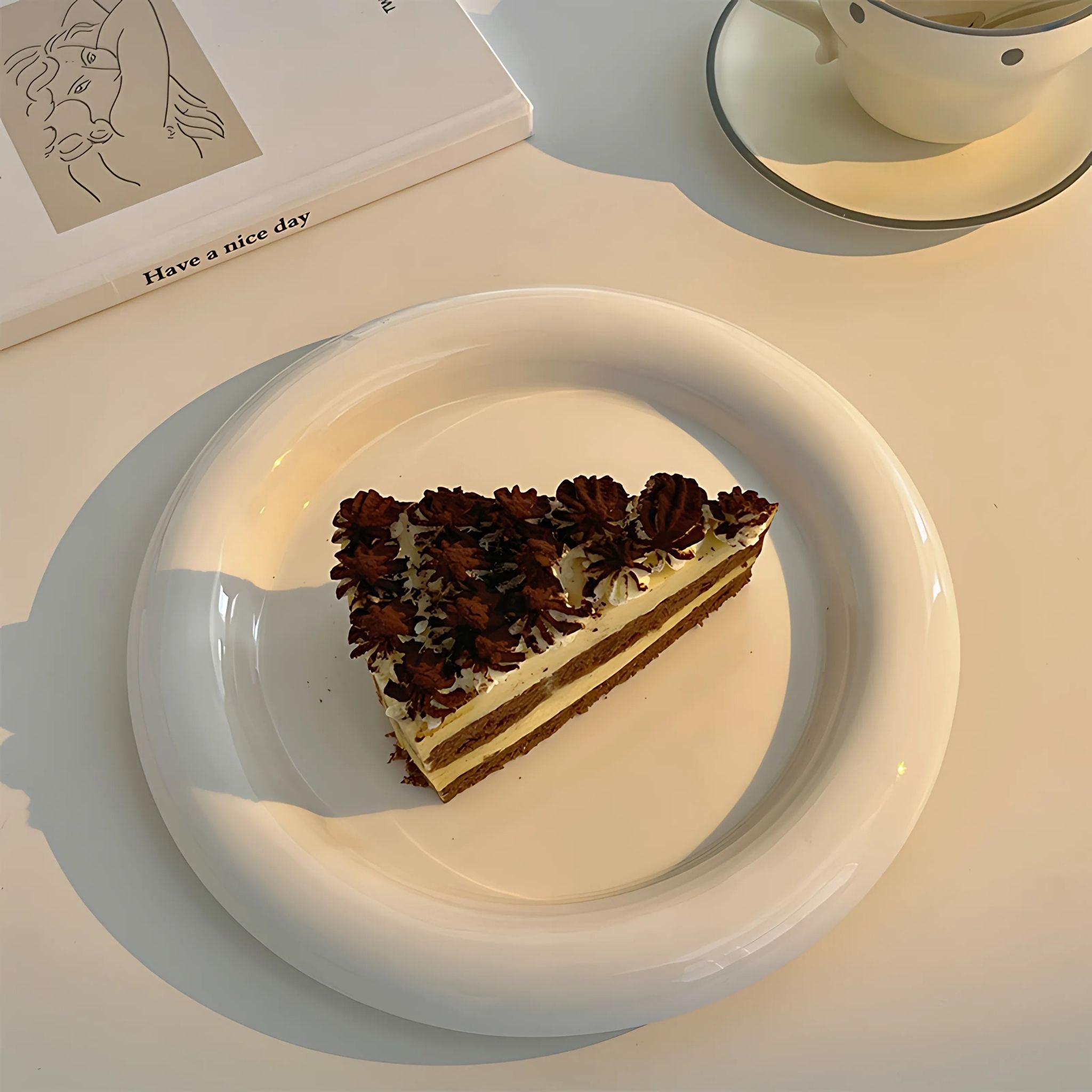 White, chub ceramic dessert plate with cake.