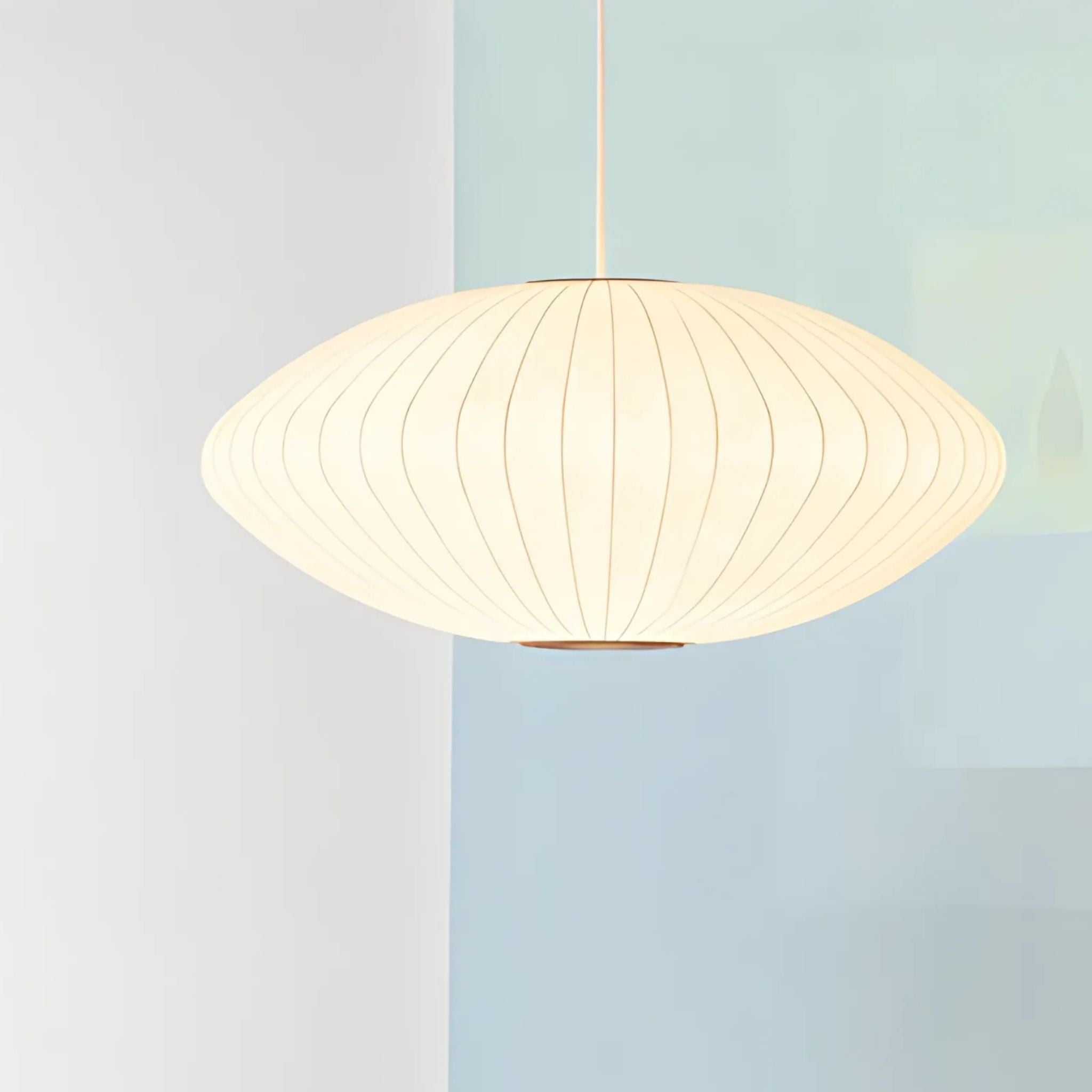 White, ceiling pendant lamp with saucer design.