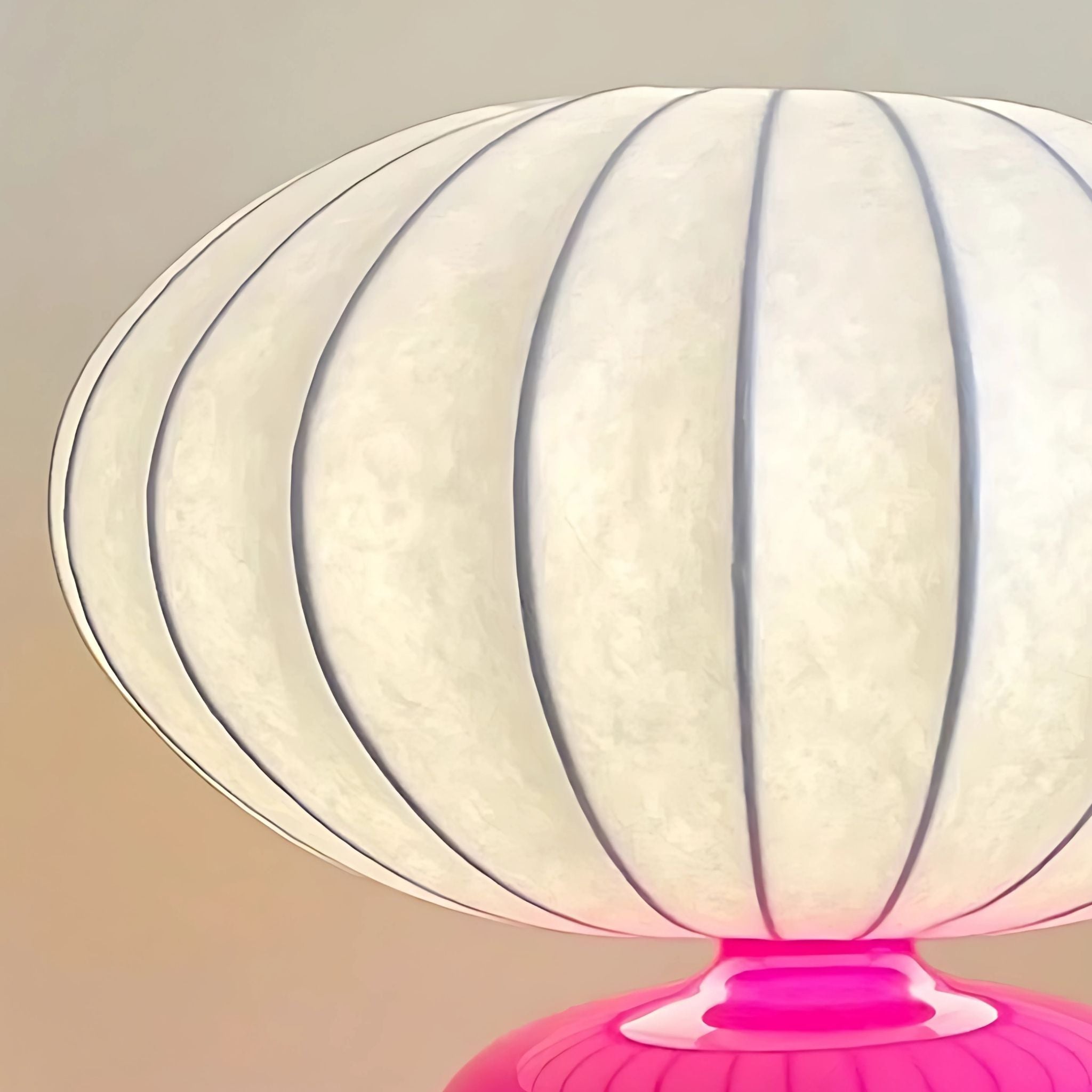 White fabric lamp shade table lamp with pink ceramic base.