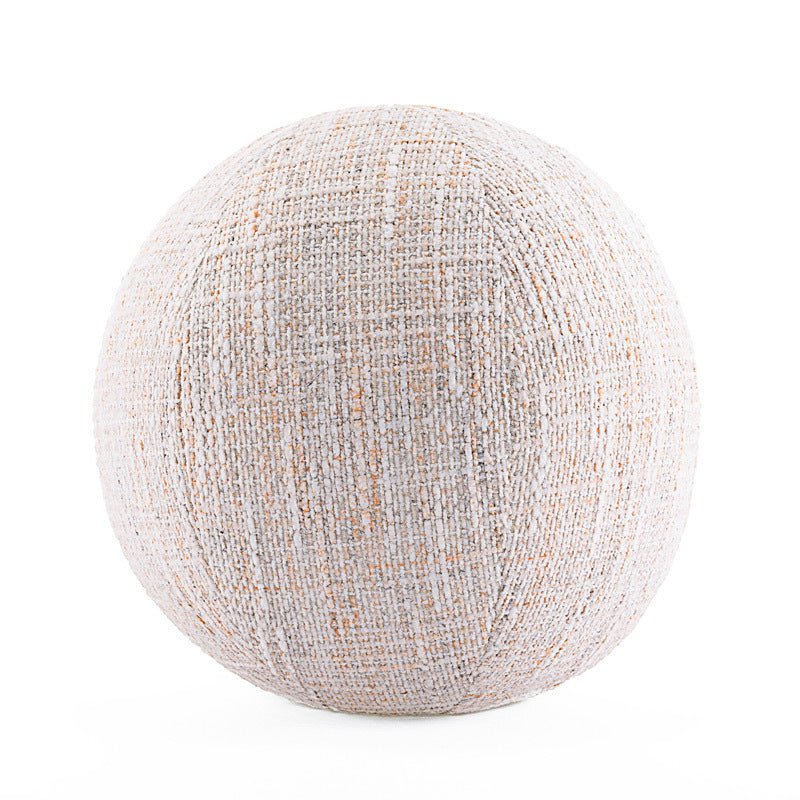 Round, white, textile decor cushion.