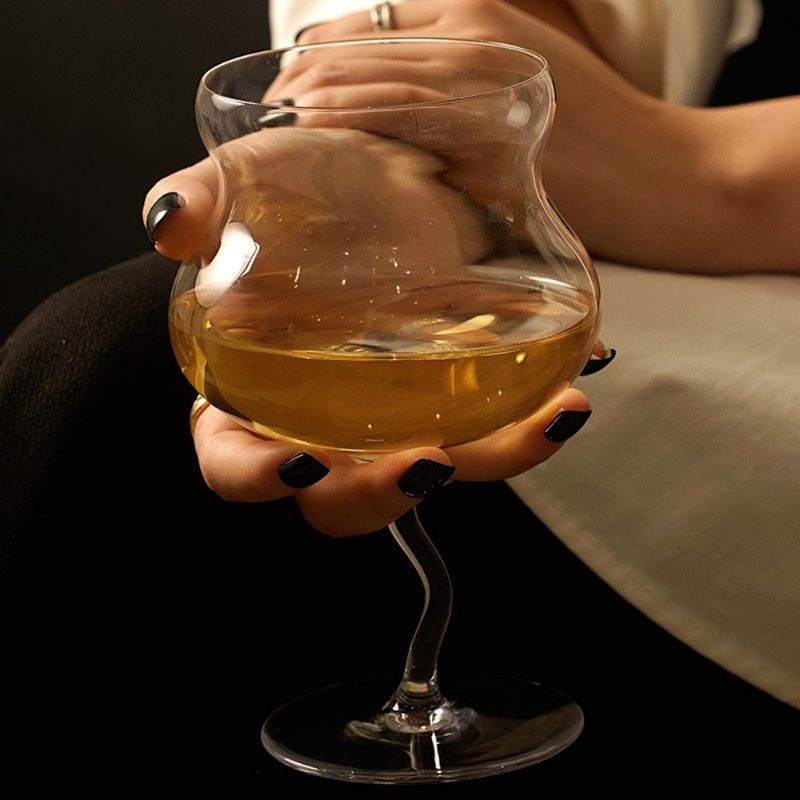 Irregular wiggle stem wine glass goblet.