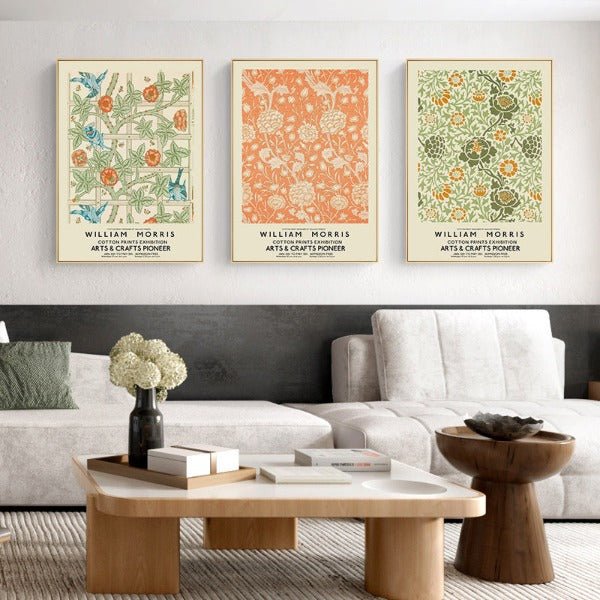 Three classic art vintage print with William Morris flower design hanging on a living room wall