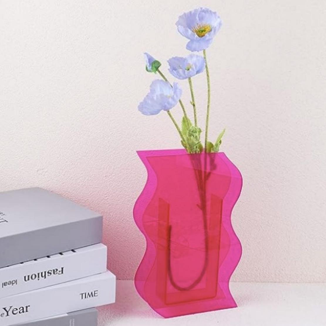 Pink, acrylic irregular vase with blue flowers