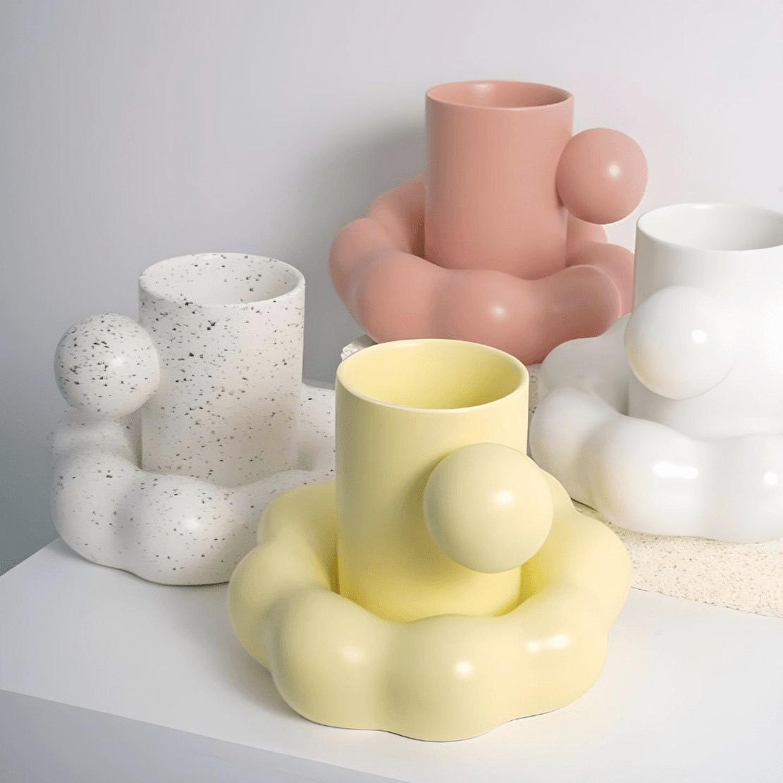 Pink white yellow ball handle mugs and cloud saucers
