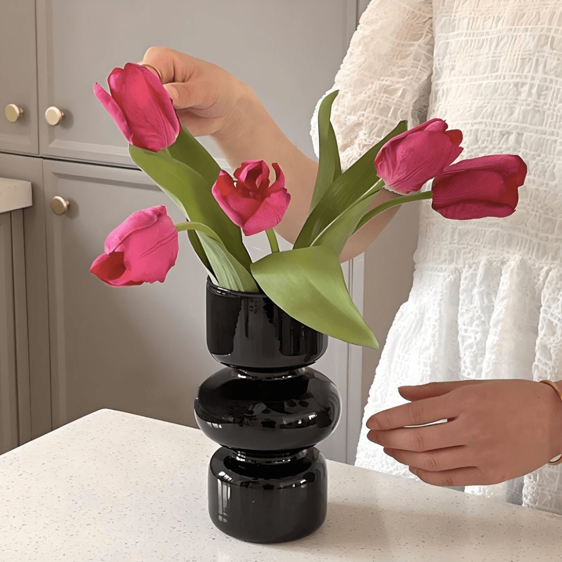 Black, geometric ball glass vase with pink tulip flowers