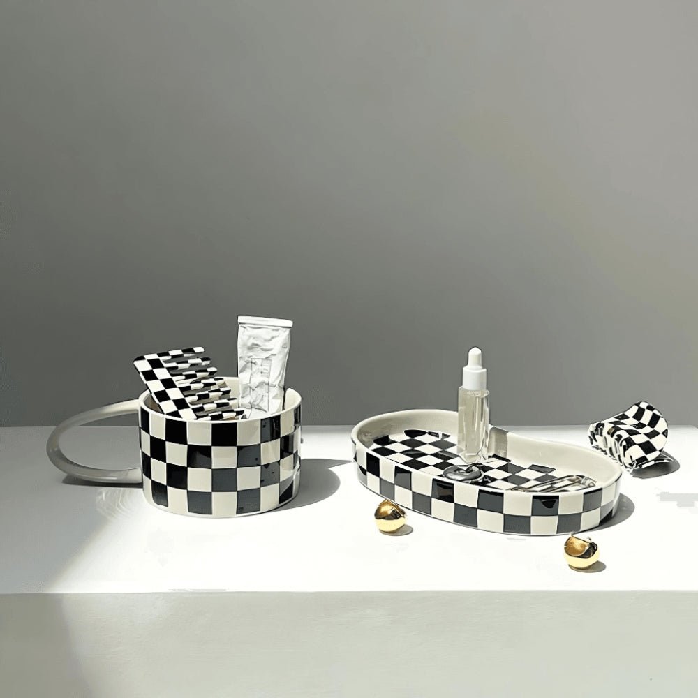 Black & white checkerboard patterned ceramic mug and irregular plate