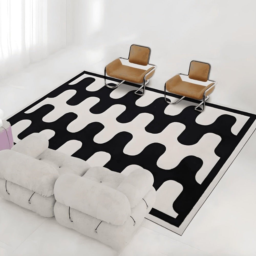 Modern design livingroom with white sofa, brown leather chair and black and white retro floor carpet