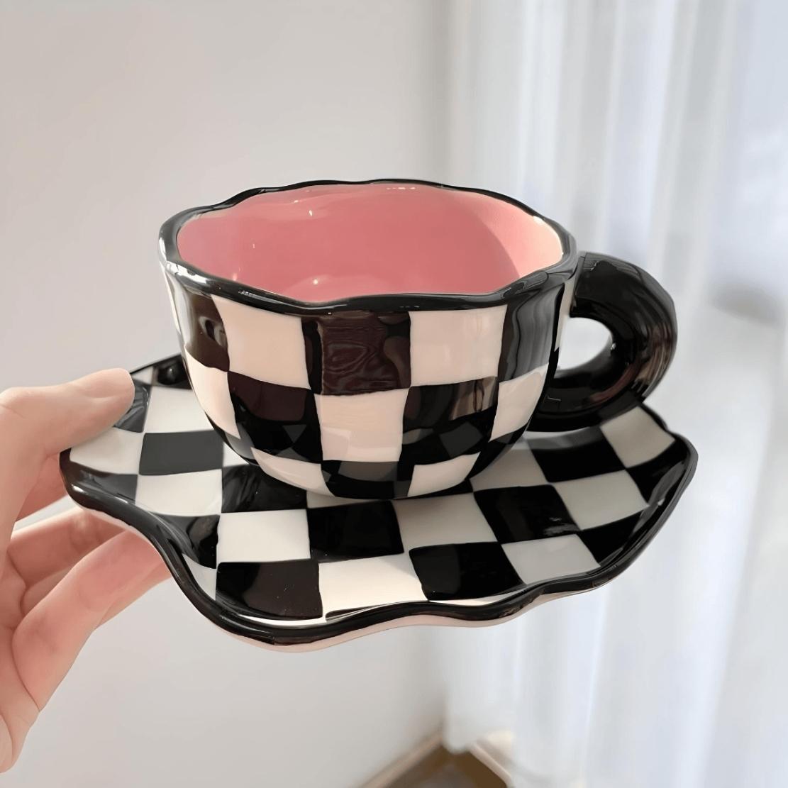 Black & white checkerboard ceramic mug with saucer