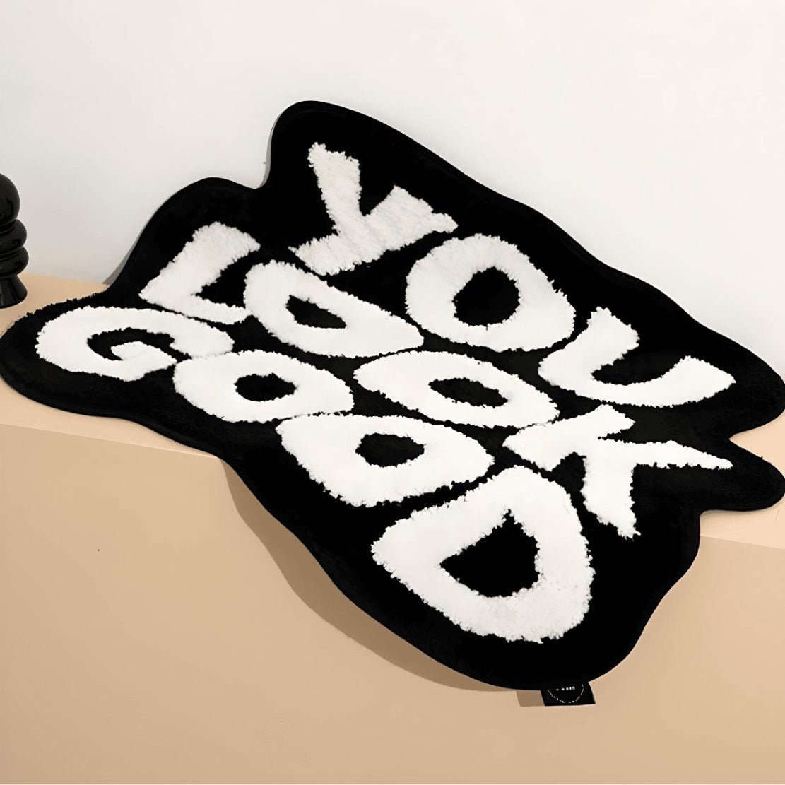 Black & white "You Look Good" text floor rug