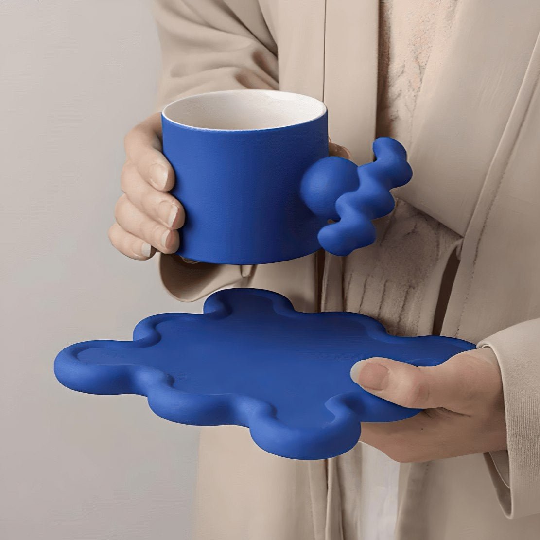 Blue, ceramic, geometrical handle mug with wavy saucer