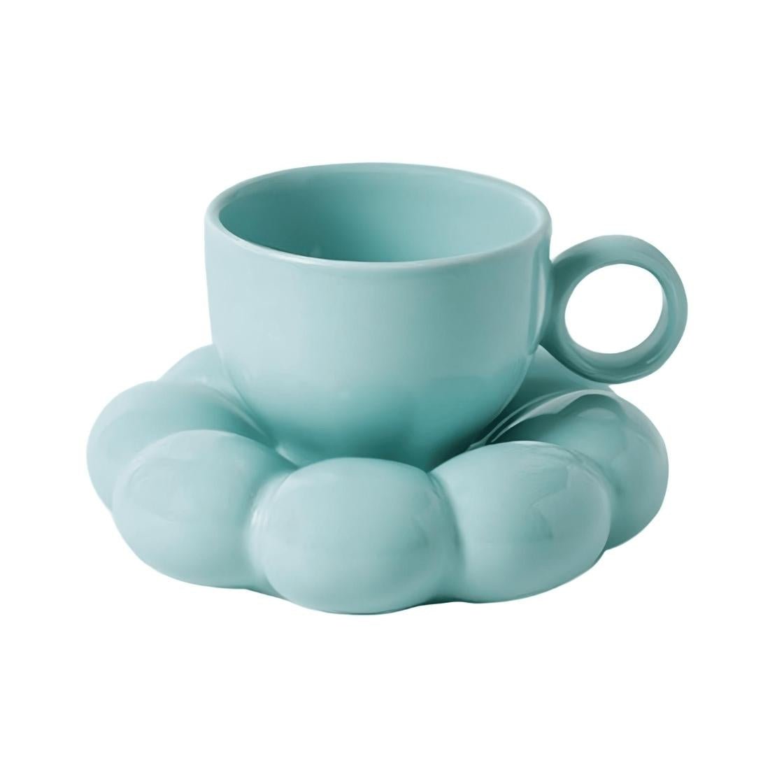 Blue tea cup with flower saucer
